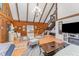 Cozy living room with wood-paneled walls, a vaulted ceiling, and comfortable seating at 300 Rabbit Run, Pittsboro, NC 27312