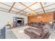 Spacious basement living room features an entertainment center, a large sectional, and modern lighting at 300 Rabbit Run, Pittsboro, NC 27312
