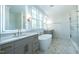 Bright bathroom featuring a modern vanity, soaking tub, and glass-enclosed shower at 3004 Eden Harbor Ct, Raleigh, NC 27613