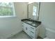 Well-lit bathroom with a dark granite countertop and a white single-sink vanity at 3004 Eden Harbor Ct, Raleigh, NC 27613