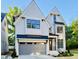 New construction with a two-car garage and craftsman-style accents with a modern design and black trim windows at 3004 Eden Harbor Ct, Raleigh, NC 27613