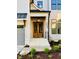 View of the front entrance featuring a beautiful wood double door, white brick stairs, and black railings at 3004 Eden Harbor Ct, Raleigh, NC 27613