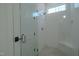 Contemporary walk-in shower with glass door, white subway tile, and built-in bench at 3004 Eden Harbor Ct, Raleigh, NC 27613