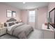 Comfortable bedroom featuring a soothing color scheme and plenty of natural light at 302 N Coral Bells Way, Four Oaks, NC 27524