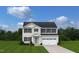 Charming two-story home with a well-manicured lawn and inviting facade at 302 N Coral Bells Way, Four Oaks, NC 27524