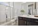Bathroom with a glass-enclosed shower, modern vanity, and patterned tile flooring at 304 Channel Cove Dr, Holly Springs, NC 27540