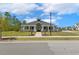 Exterior view of the community center in a neighborhood with manicured landscaping at 304 Channel Cove Dr, Holly Springs, NC 27540