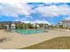 Community pool area, surrounded by houses, with clear blue water on a sunny day at 304 Channel Cove Dr, Holly Springs, NC 27540