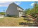 Exterior of the home with a two-car garage and lush landscaping surrounding the home at 304 Channel Cove Dr, Holly Springs, NC 27540