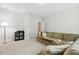 Cozy living room featuring a comfortable sofa and bright overhead lighting at 304 Channel Cove Dr, Holly Springs, NC 27540