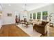 Inviting living room with a large window offering scenic outdoor views and hardwood flooring at 304 Channel Cove Dr, Holly Springs, NC 27540