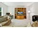 Inviting living room featuring a built in entertainment center and large windows at 304 Channel Cove Dr, Holly Springs, NC 27540