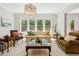 Bright living room with hardwood floors, a large window with nature views at 304 Channel Cove Dr, Holly Springs, NC 27540