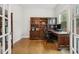 Home office with wood bookcase, desk, and natural light from the window at 304 Channel Cove Dr, Holly Springs, NC 27540