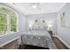 Bedroom featuring a large window and wood floors at 308 Hassellwood Dr, Cary, NC 27518