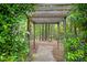 Pathway through a shady landscape with lush greenery and trees at 308 Hassellwood Dr, Cary, NC 27518