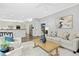 Open-concept layout featuring a cozy living room adjacent to the kitchen and dining areas at 308 Hassellwood Dr, Cary, NC 27518