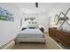Bright bedroom features a queen bed, stylish furnishings, and natural light from the window at 310 Georgetown Rd, Raleigh, NC 27608