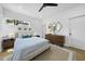 Bright bedroom features a queen bed, stylish furnishings, and natural light from the window at 310 Georgetown Rd, Raleigh, NC 27608