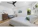 Bright bedroom features a queen bed, stylish furnishings, and natural light from the window at 310 Georgetown Rd, Raleigh, NC 27608