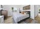Stylish bedroom features a comfortable bed, natural light, hardwood floors, and curated decor at 310 Georgetown Rd, Raleigh, NC 27608