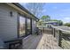 Spacious deck with wood flooring, metal railings, and comfortable seating, perfect for outdoor relaxation at 310 Georgetown Rd, Raleigh, NC 27608