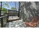Outdoor lounge area features a comfortable sofa and modern railing with a view at 310 Georgetown Rd, Raleigh, NC 27608