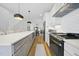 Modern kitchen boasts stainless steel appliances, a large island, and ample cabinet space at 310 Georgetown Rd, Raleigh, NC 27608
