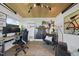 Contemporary office space with wood ceiling, white walls, modern furniture and decor, and stylish lighting at 310 Georgetown Rd, Raleigh, NC 27608