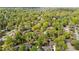 An aerial perspective of a home surrounded by lush greenery and a vibrant tree canopy at 3126 Truitt Dr, Burlington, NC 27215