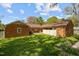 A spacious backyard showcasing a brick home with patio and privacy fence at 3126 Truitt Dr, Burlington, NC 27215