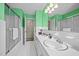 Well-lit bathroom featuring a shower with glass door and vanity with a large mirror at 3126 Truitt Dr, Burlington, NC 27215