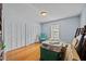 Bedroom featuring hardwood floors, two large closets, and ample storage containers at 3126 Truitt Dr, Burlington, NC 27215