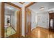 Bright hallway with hardwood floors leads to other rooms in the home at 3126 Truitt Dr, Burlington, NC 27215