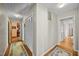 Hallway with hardwood floors featuring closet space at 3126 Truitt Dr, Burlington, NC 27215