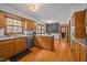 Bright kitchen with wood cabinets, granite countertops, stainless steel appliances and hardwood floors at 3126 Truitt Dr, Burlington, NC 27215