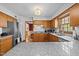 This cozy kitchen offers wood cabinets, granite countertops, stainless steel appliances, and hardwood floors at 3126 Truitt Dr, Burlington, NC 27215