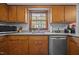 Bright kitchen features wood cabinets, granite countertops, and stainless steel appliances at 3126 Truitt Dr, Burlington, NC 27215
