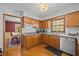This cozy kitchen offers wood cabinets, granite countertops, stainless steel appliances and hardwood floors at 3126 Truitt Dr, Burlington, NC 27215