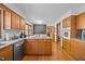 Bright kitchen features wood cabinets, granite countertops, stainless steel appliances and hardwood floors at 3126 Truitt Dr, Burlington, NC 27215