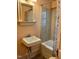 Classic bathroom featuring a pedestal sink, shower-tub combination, and vintage charm at 330 W King St, Hillsborough, NC 27278