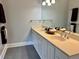 Bathroom boasts a double vanity with ample counter space, stylish fixtures, and a large mirror at 330 W King St, Hillsborough, NC 27278