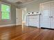 Bright bedroom with beautiful hardwood floors, fireplace and built-in storage cabinets and shelving at 330 W King St, Hillsborough, NC 27278