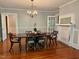 Open dining room with hardwood floors, chandelier, and a classic, formal feel. Ready for entertaining! at 330 W King St, Hillsborough, NC 27278