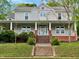 Charming two-story home with a welcoming front porch and landscaped front yard at 330 W King St, Hillsborough, NC 27278