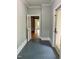 Hallway with tile flooring and neutral paint color at 330 W King St, Hillsborough, NC 27278