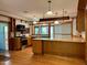Spacious kitchen featuring hardwood floors, granite countertops, and wooden cabinets at 330 W King St, Hillsborough, NC 27278