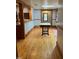 Hardwood floors throughout this open concept room leading to the kitchen and other rooms at 330 W King St, Hillsborough, NC 27278