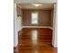 Spacious room featuring hardwood floors, natural light, and neutral paint. Ready to be furnished! at 330 W King St, Hillsborough, NC 27278