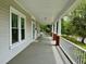 Spacious front porch with ample seating area and charming architectural details at 330 W King St, Hillsborough, NC 27278